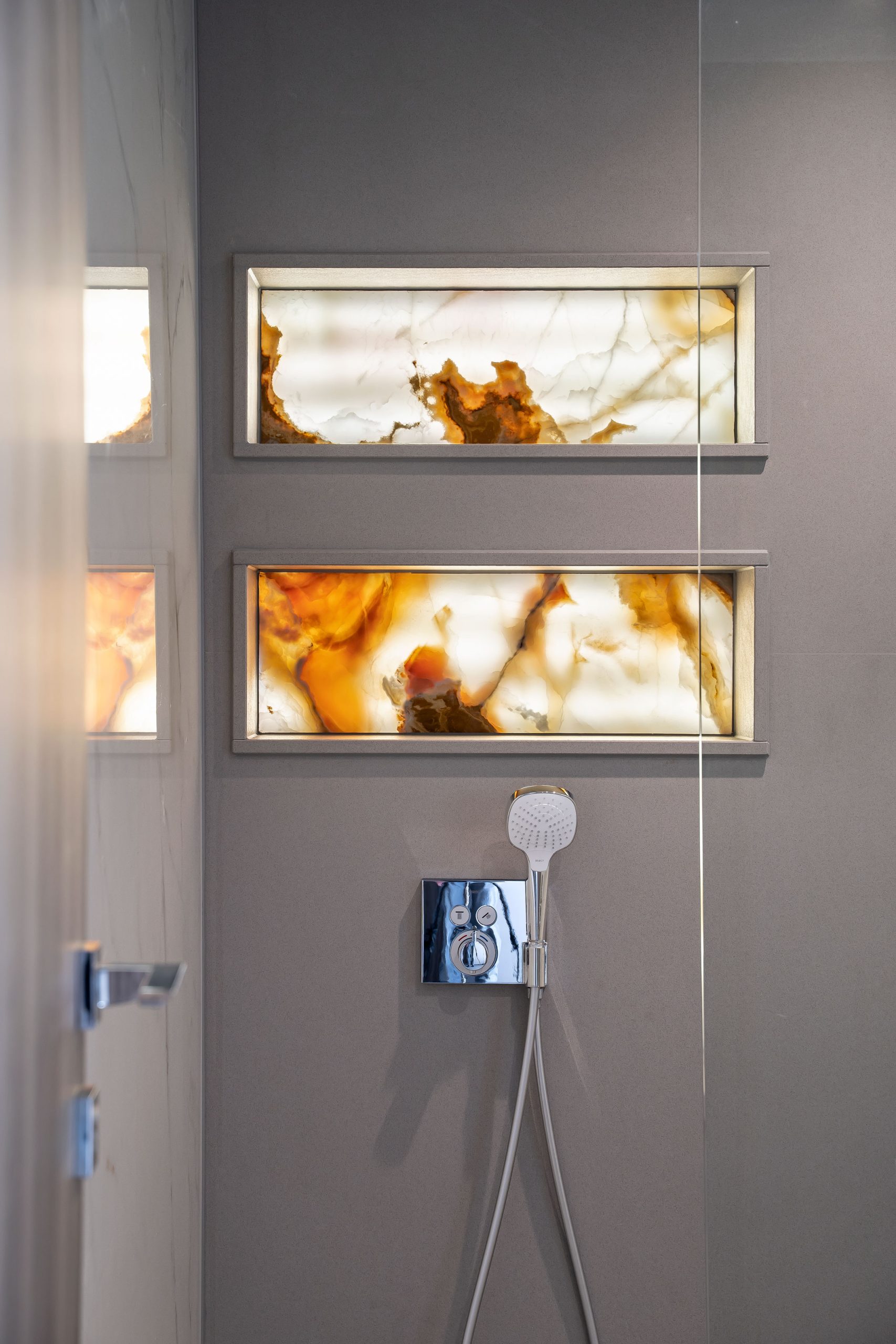 Onyx shelf and quartz shower cladding by Classico Marble | stone masons in berkshire